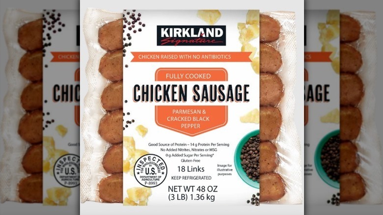 Package of Kirkland chicken sausage on white background