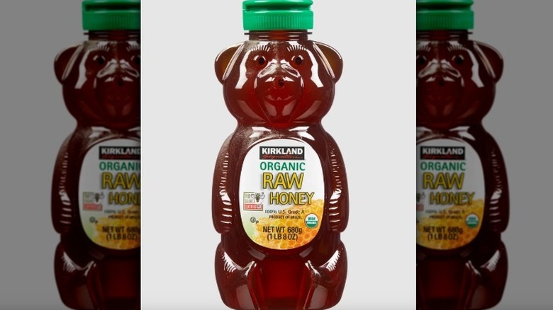 Kirkland organic raw honey bear on white background