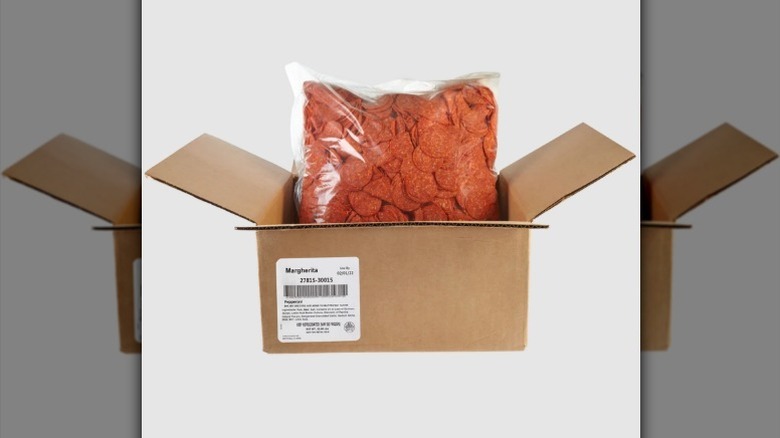 Bag of pepperoni in box on white background