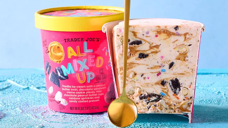 All Mixed Up ice cream carton cut open, next to a full carton and a spoon
