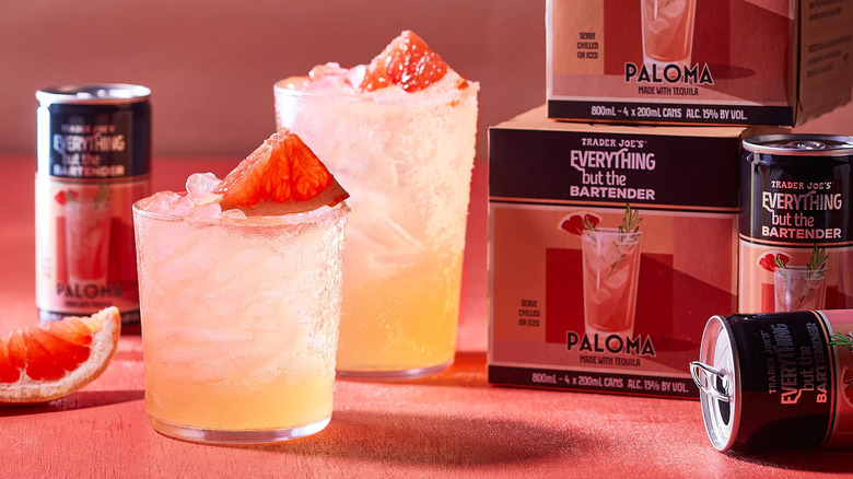 Canned palomas in glasses with ice next to two boxes