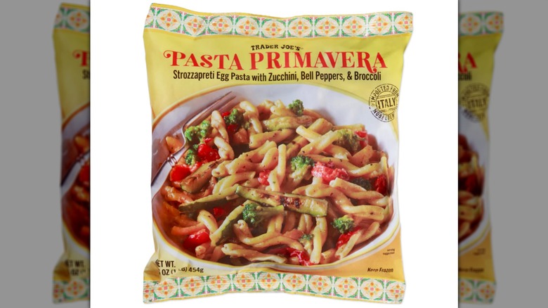 A bag of pasta primavera on a white background