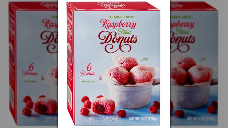 A box of raspberry-filled donuts on a white background