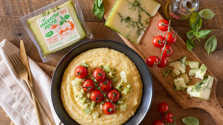 The Sheepish Pesto cheese with food and cutlery on a wooden table