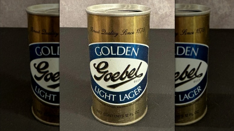 A vintage can of Goebel beer with a yellow, blue, and white label that calls it a Golden Light Lager
