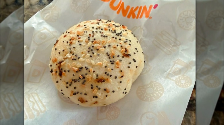 A Dunkin' Everything Bagel Mini on a Dunkin' bag