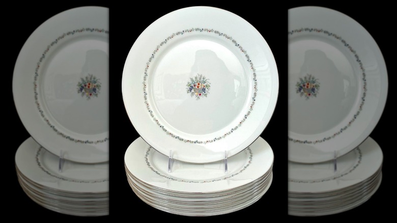 A plate with the Lenox Carlyle pattern on top of a stack of other Carlyle-patterned plates
