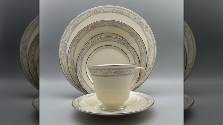 Several plates and a teacup with the Lenox Charleston pattern