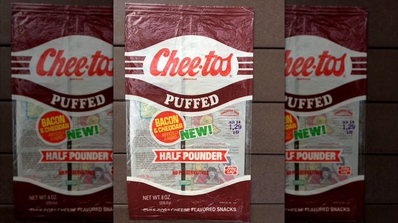 An old, empty package of Bacon & Cheddar Cheetos