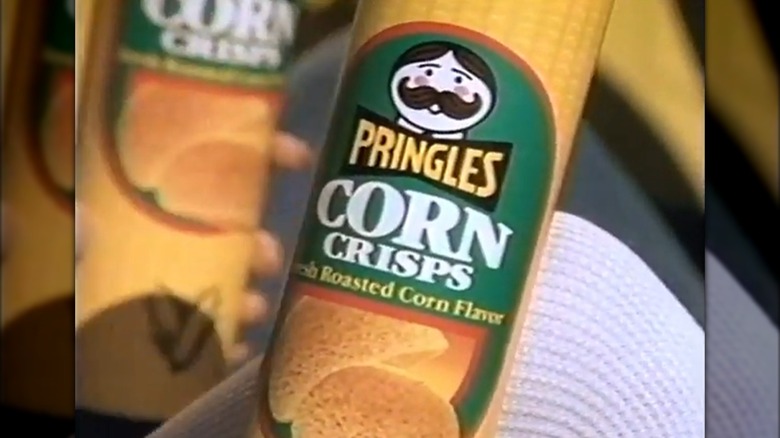 A still from a Pringles Corn Crisps advertisement with a close-up on a can of chips