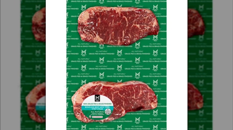 A package of two individually wrapped New York strip steaks from Sam's Club on a white background