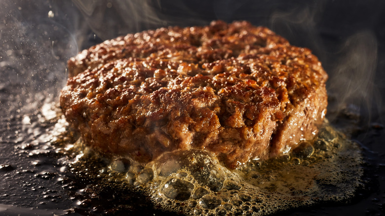 A burger on the griddle