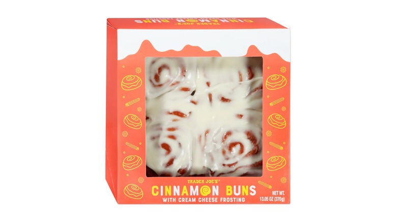 Box of cinnamon buns with an orange label against a white background.
