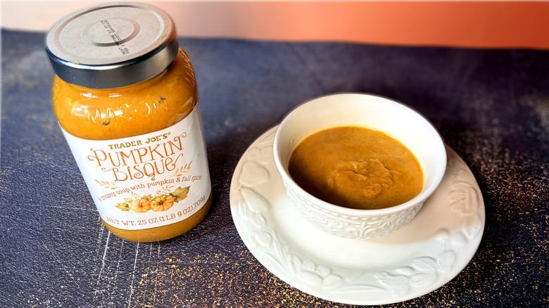 Jar and bowl of pumpkin bisque
