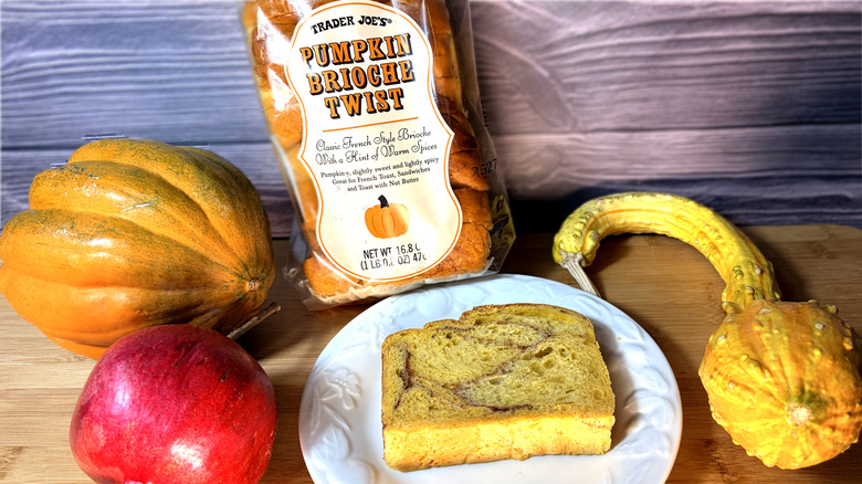 Package of bread with one slice on plate
