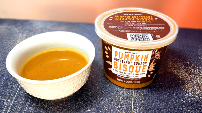 Bowl and container of pumpkin bisque