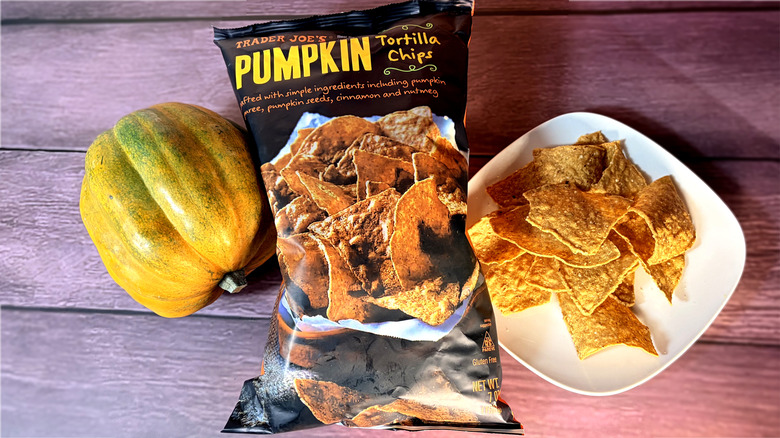 Top view of bag and plate of pumpkin tortilla chips