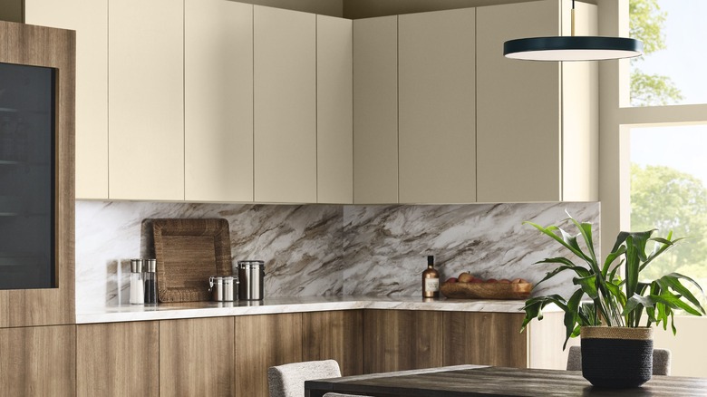 Upper kitchen cabinets painted in Sherwin-Williams Universal Khaki