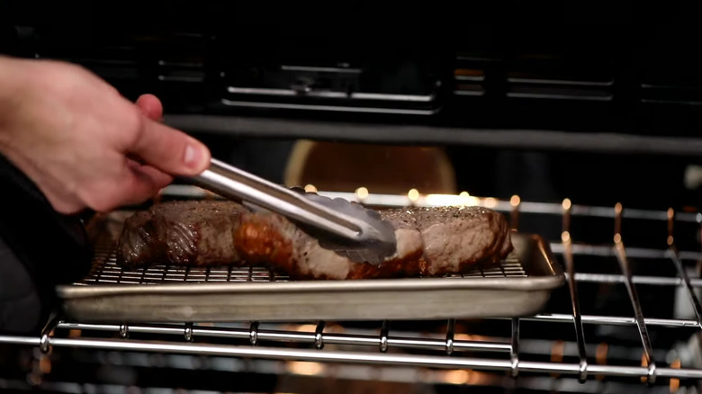 Chef flipping steak