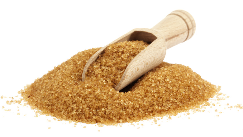 Brown sugar in wooden spoon