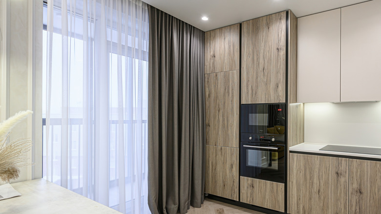 Neutral kitchen with sheer curtains