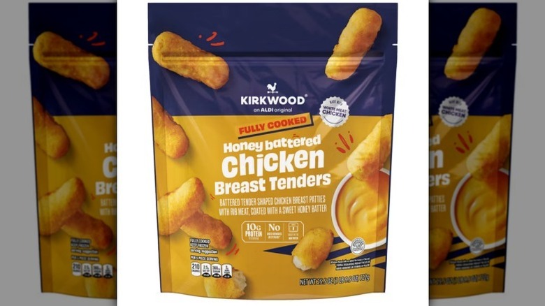 Honey battered chicken breast tenders on white background