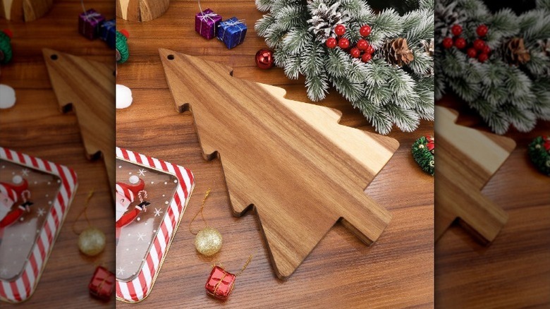 Christmas tree charcuterie board with holiday decorations
