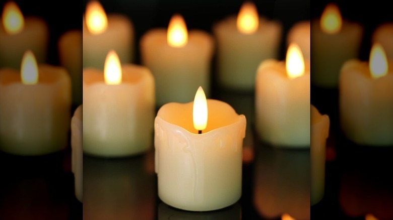 Flameless candles on black counter