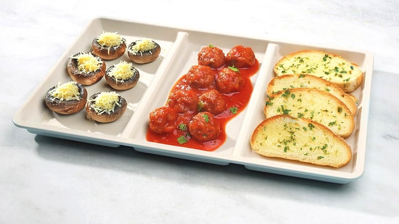 Three section roasting pan on white counter