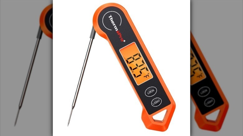 Digital meat thermometer on white background