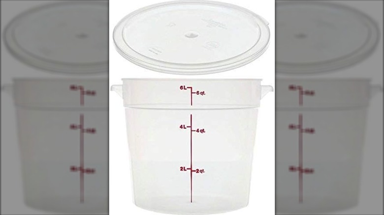 plastic container with red measure marks and lid