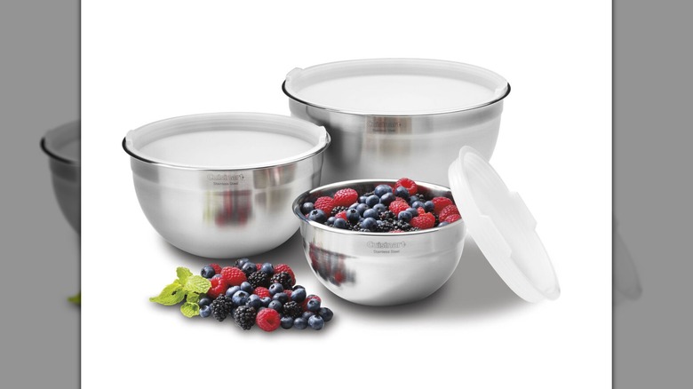 Cuisinart 3-Piece Stainless Steel Mixing Bowl Set with Lids on a white background, one bowl filled with fruit