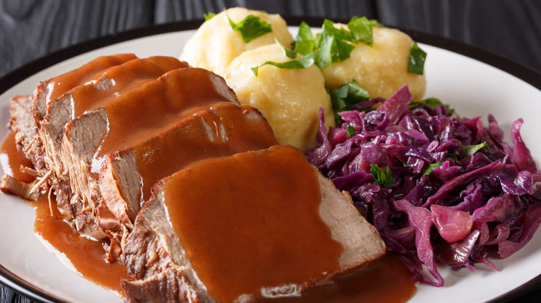 plate of sour beef and dumplings