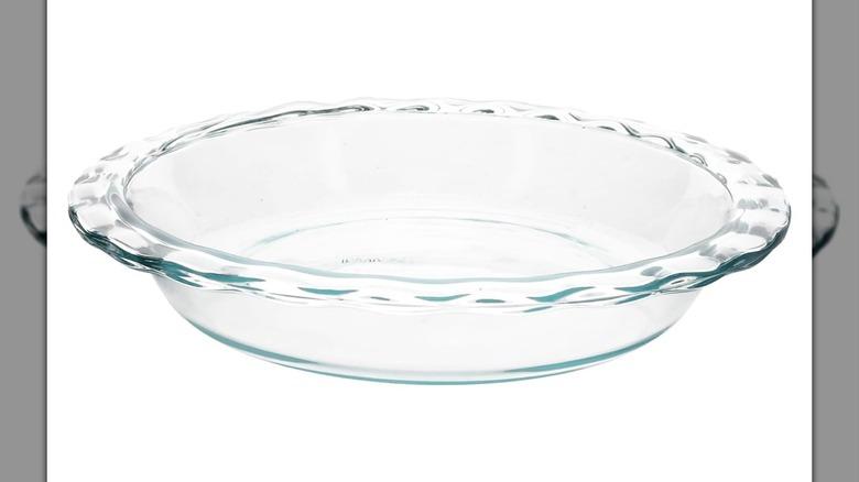 Pyrex glass fluted rim pie dish on a white background