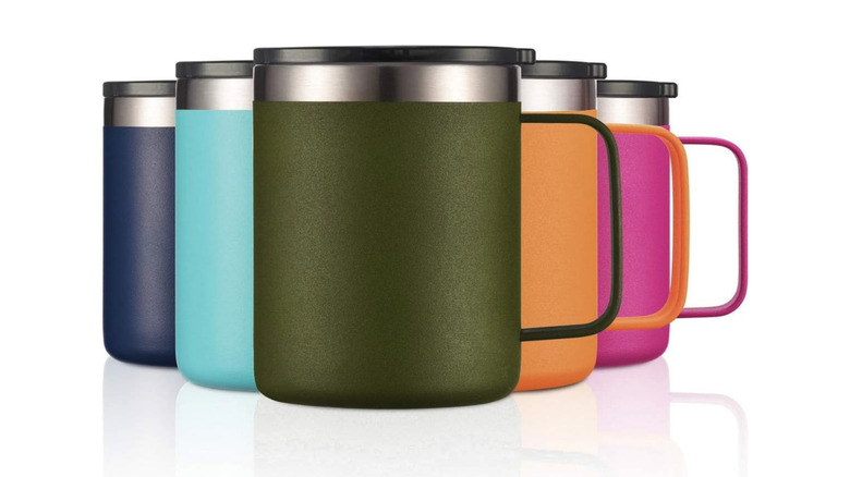 Travel coffee mugs in various colors with handles