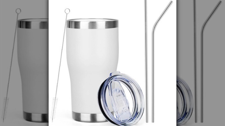 White tumbler mug with two straws and straw cleaner