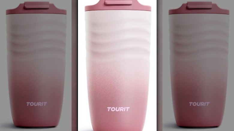 Pink ombre travel coffee mug on white background