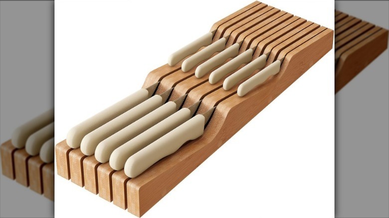 Knife organizer for drawer on white background