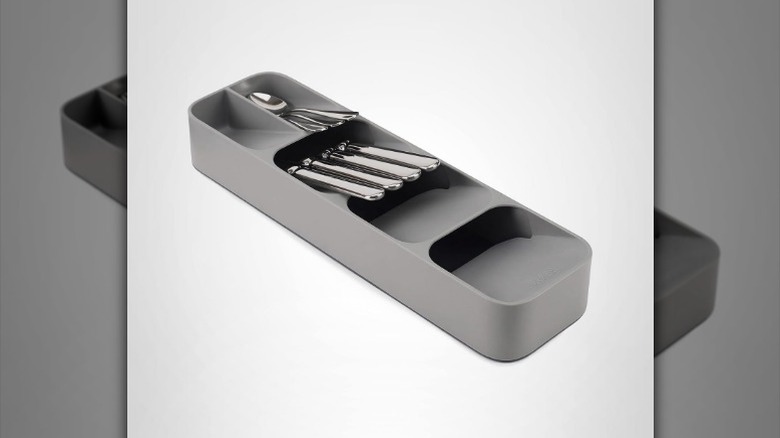 Compact utensil organizer with cutlery on white background