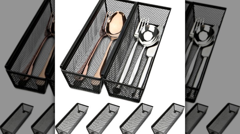 Steel mesh organizers on white background with cutlery