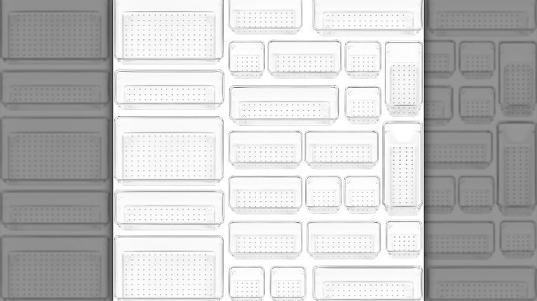 Clear plastic drawer organizer set on white background
