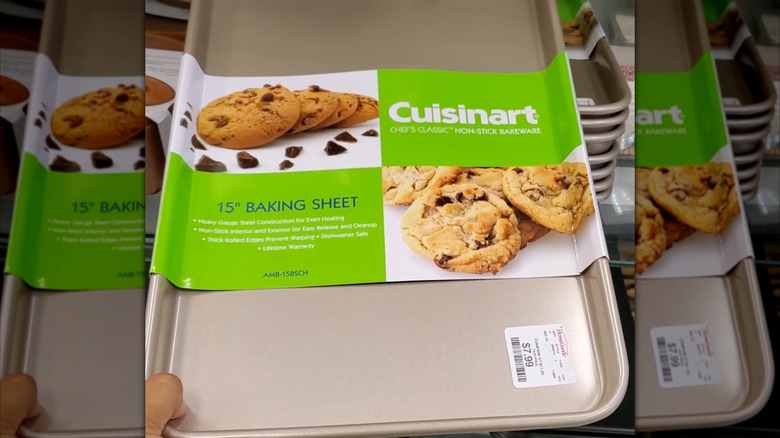 Hand holding a Cuisinart brand baking sheet