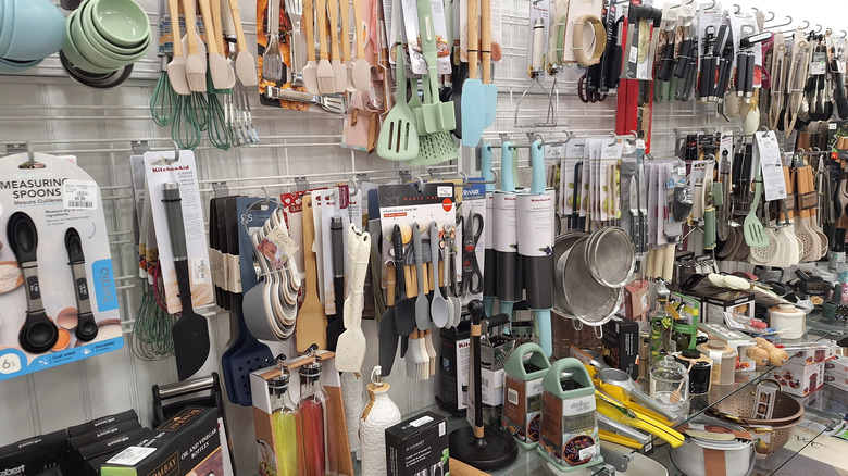 Wall of kitchen accessories and tools in HomeGoods store
