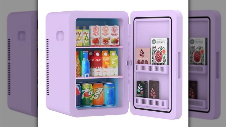 Purple mini fridge on white background