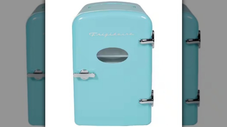 Retro fridge on white background