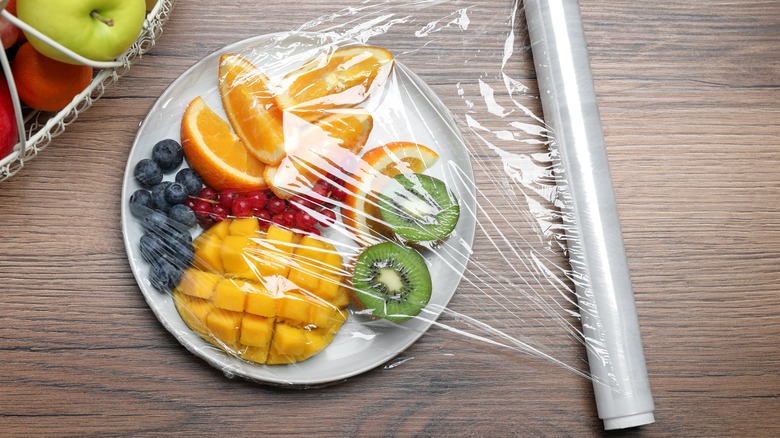 plastic wrap covering cut fruit