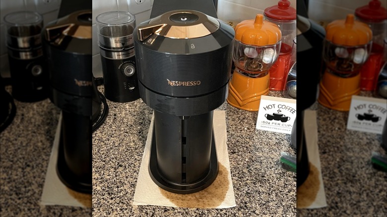 A Nespresso machine with a leak at the bottom