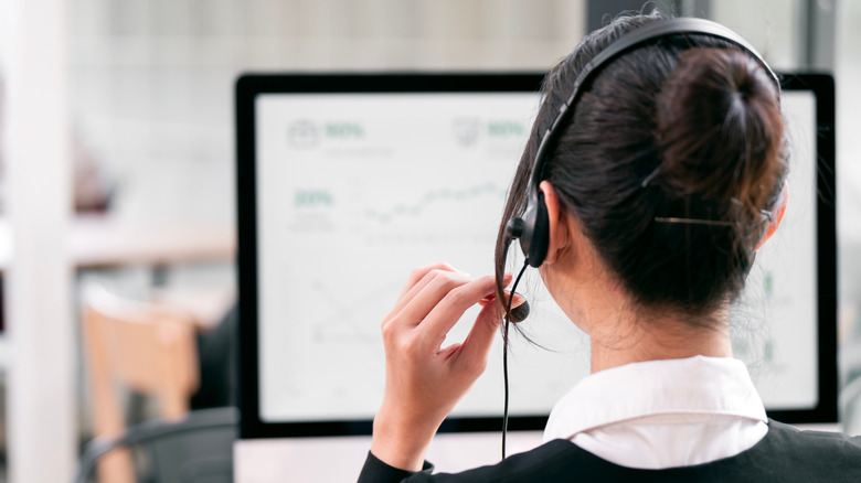 A customer service representative, seen from behind