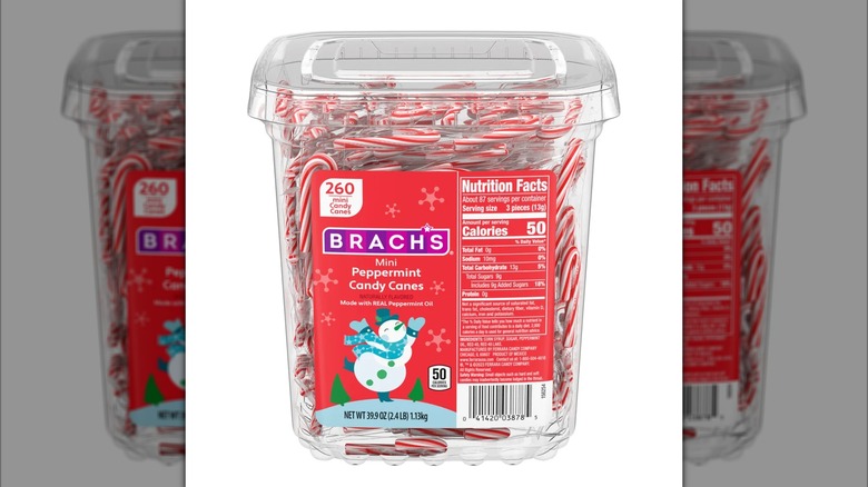 A clear plastic container of 260 miniature candy canes