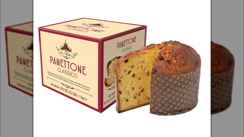 A box of deMilan panettone classico, with the Christmas cake next to it